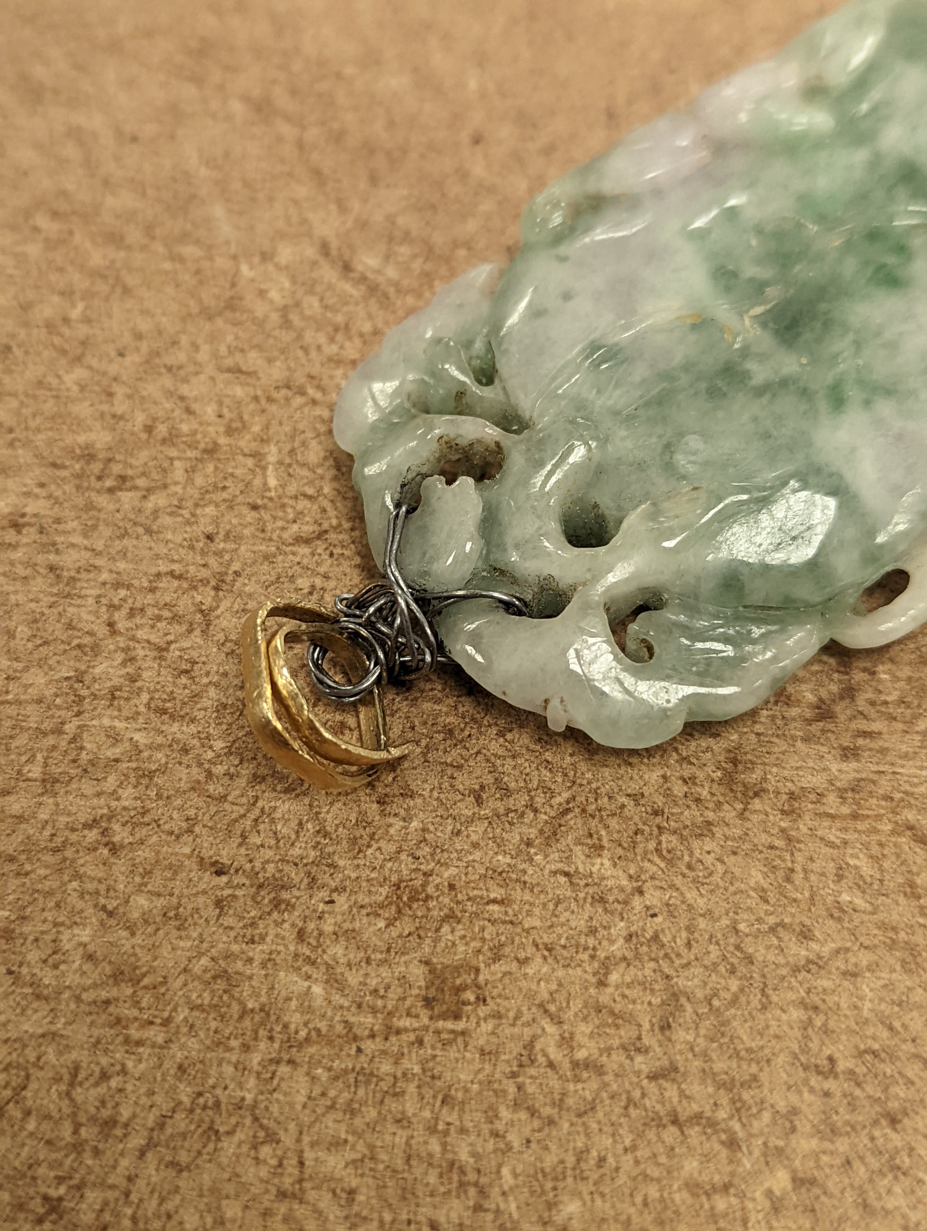 A Chinese mottled jadeite plaque 8cm